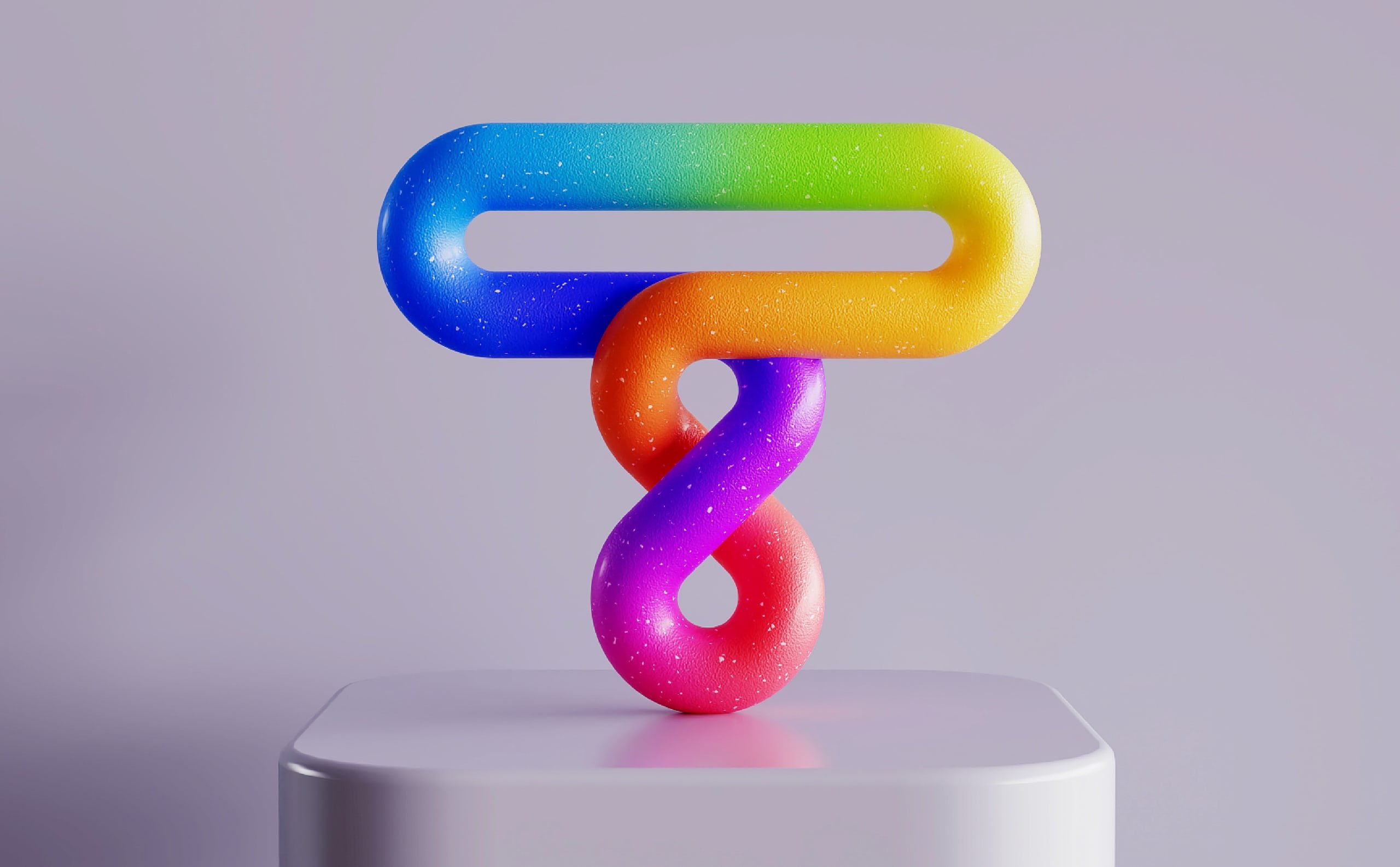 Colorful 3D logo sculpture on a pedestal
