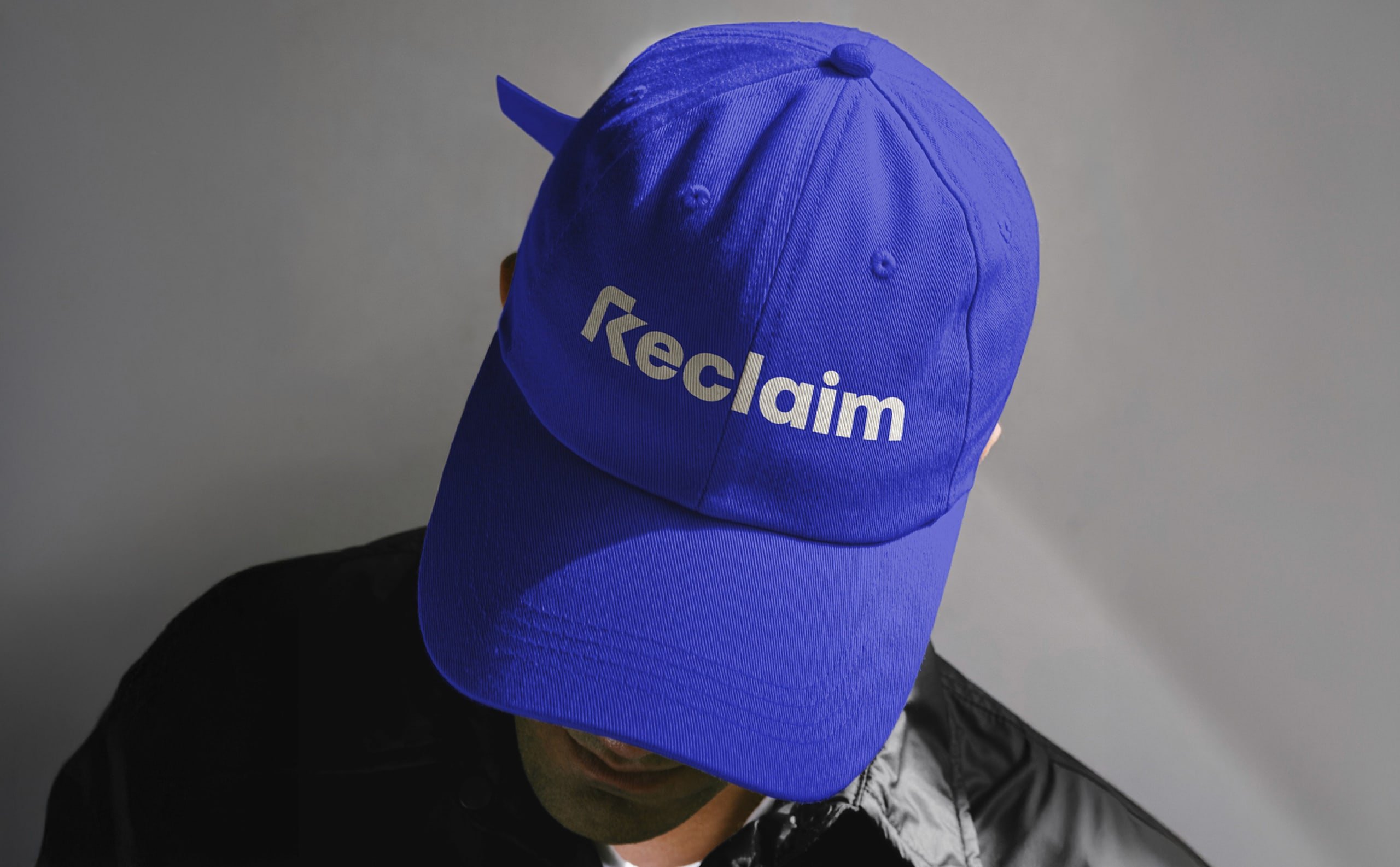 Person wearing a blue Reclaim cap